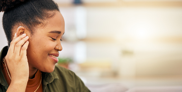 Deaf, hearing aid and disabled woman connect healthcare tech, communication and health insurance. Medical, listening device or ear piece, young professional face with focus, help or success with tech